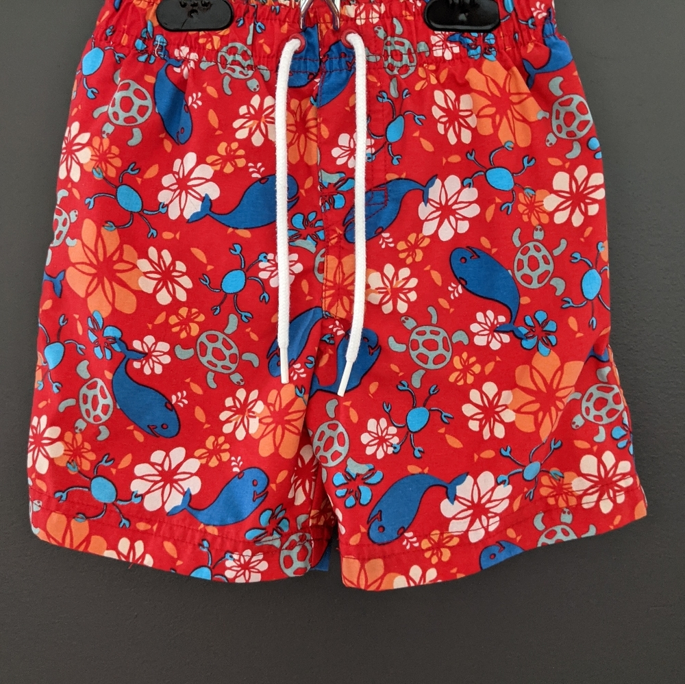 Red ocean print swim trunks